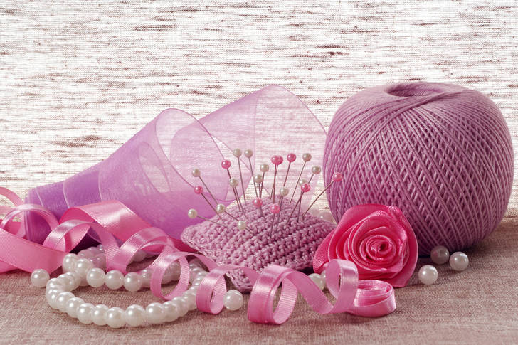 Pink satin ribbon, pins and pearls