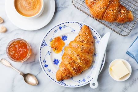 Croissants with jam and coffee