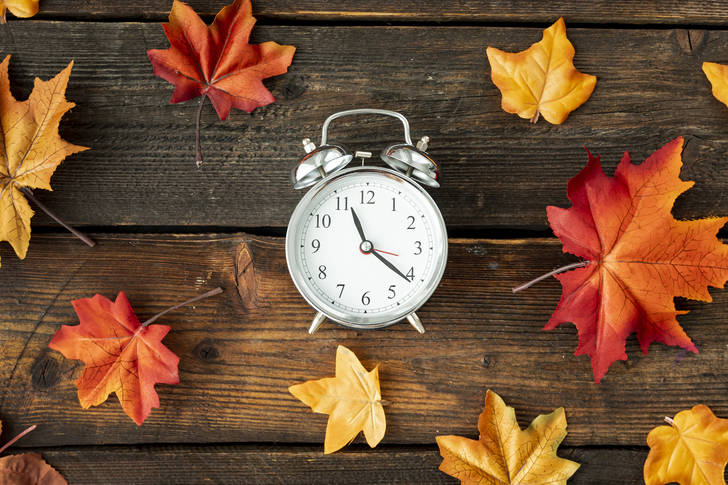 Clock with autumn leaves