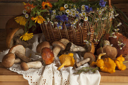 Basket with flowers and forest mushrooms