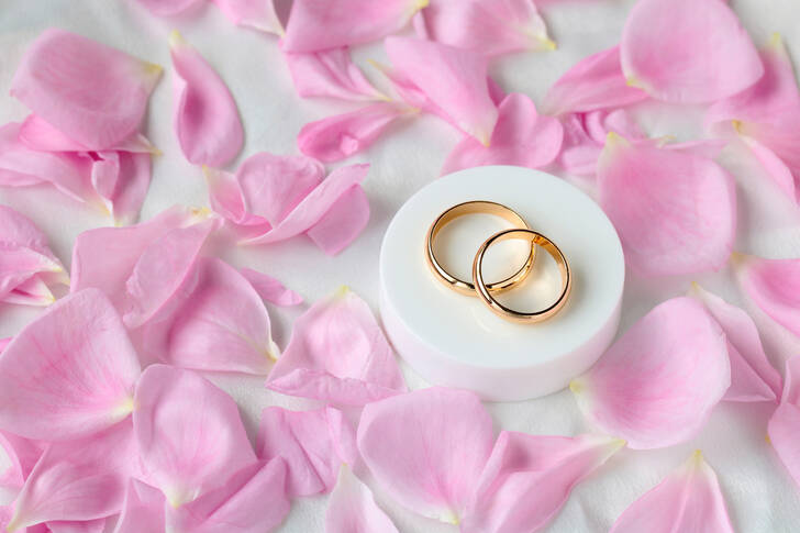 Wedding rings and rose petals