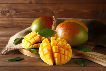 Mango on wooden board