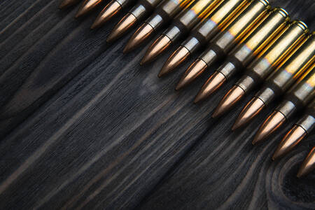 Cartridges on wooden background