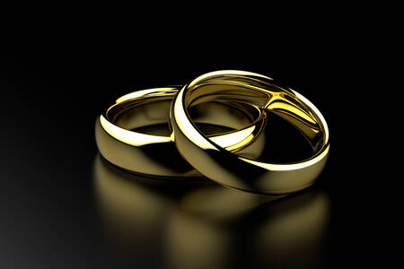 Wedding rings on a black background