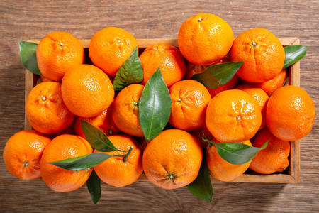 Tangerines in a wooden box