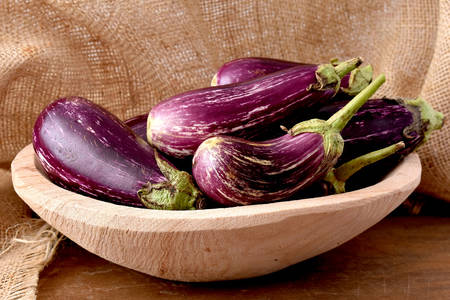 Eggplant in a wooden bowl
