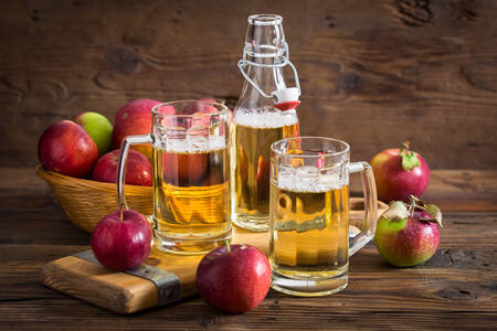 Cider and apples on the table
