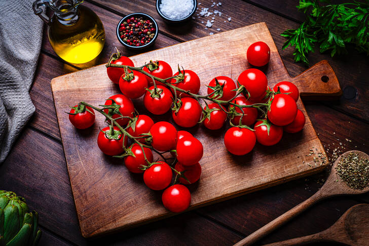Cherry tomatoes on a cutting board