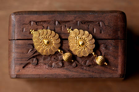 Gold earrings in oriental style