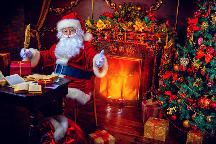 Santa Claus by the fireplace