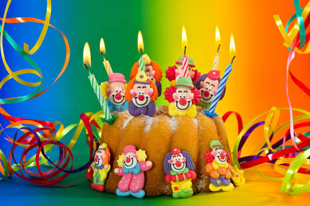 Cake with funny clowns and candles