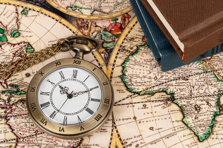 Pocket watch on map background