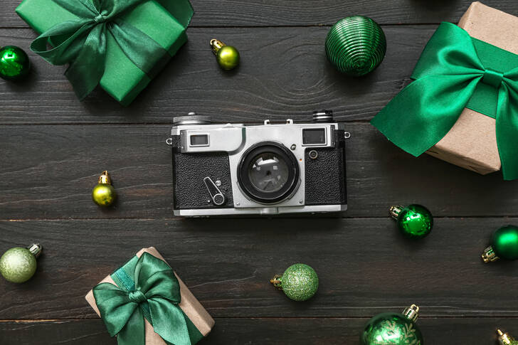 Camera with Christmas ornaments and gifts