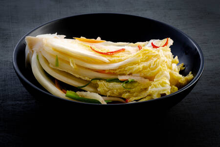 Kimchi on a black plate