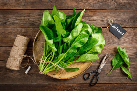 Fresh spinach on a wooden board