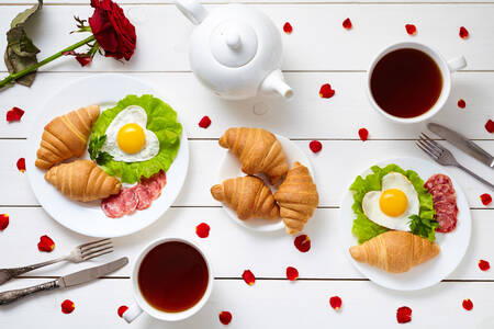Breakfast with croissants and scrambled eggs