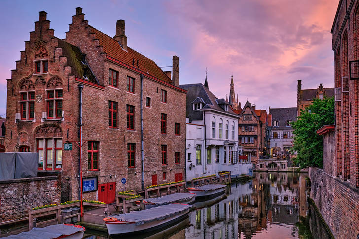 Bruges canal and houses at sunset