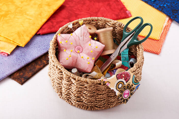 Sewing supplies in a wicker basket