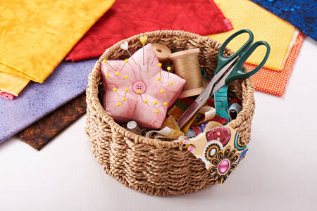 Sewing supplies in a wicker basket