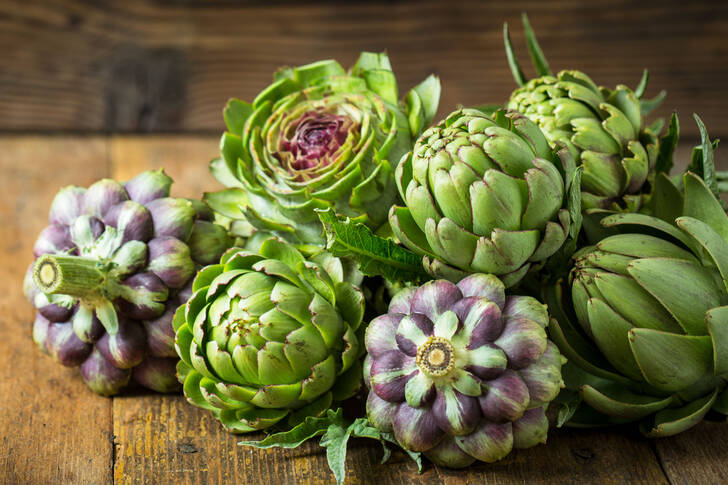 Artichokes on a wooden table