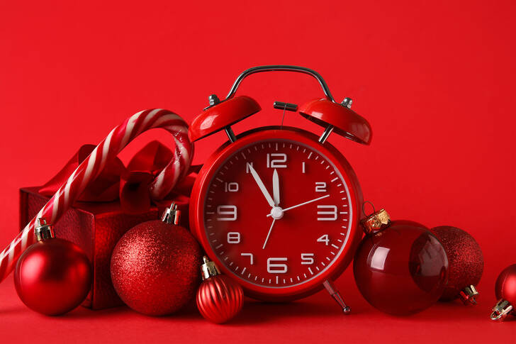 Red alarm clock and Christmas tree balls