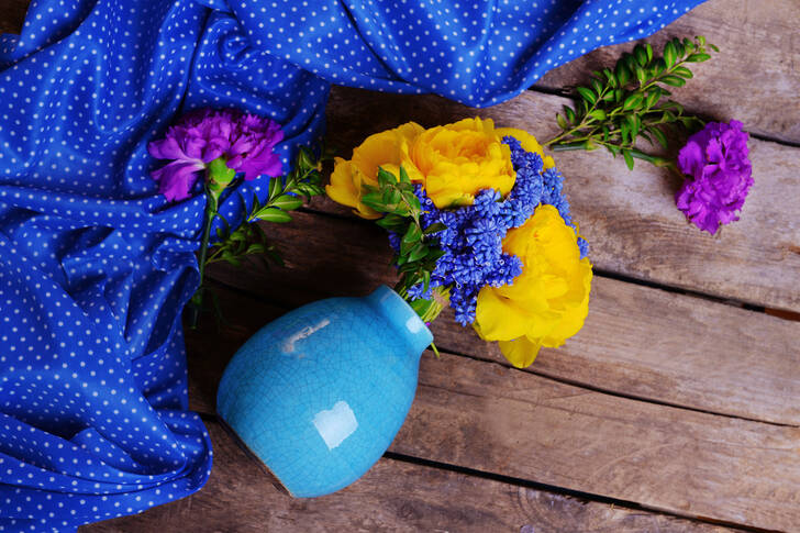 Yellow and blue flowers in a vase