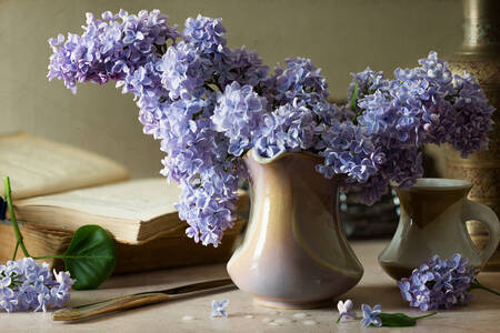 A bouquet of lilacs in a ceramic vase