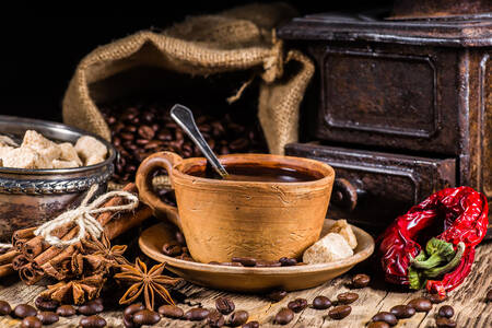 Cup of coffee and spices on the table