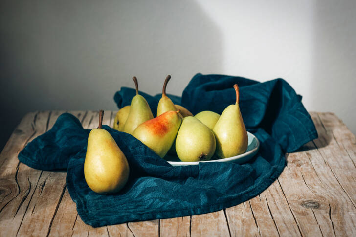 Ripe pears on a wooden table