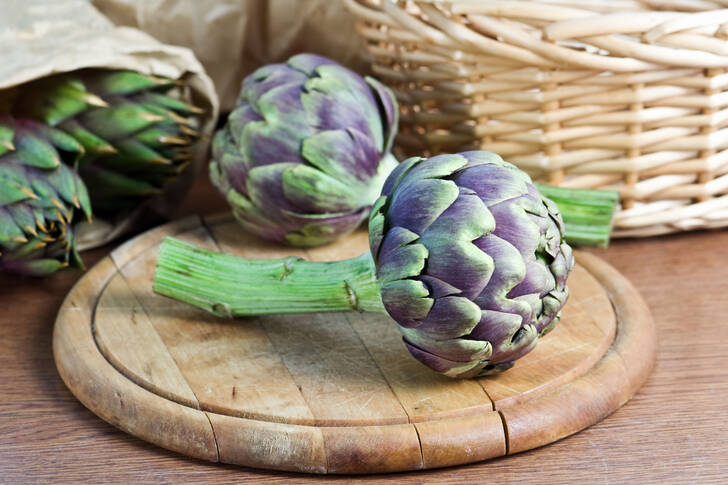 Artichokes on a wooden board