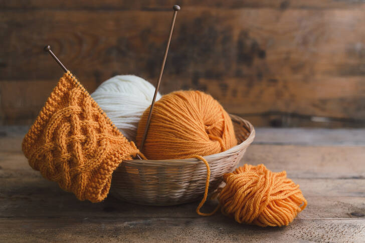 Skeins of orange and white yarn