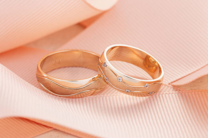 Wedding rings on a pink ribbon