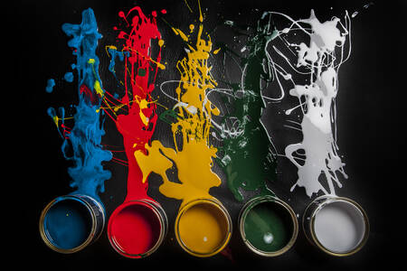 Colorful paints on a black background