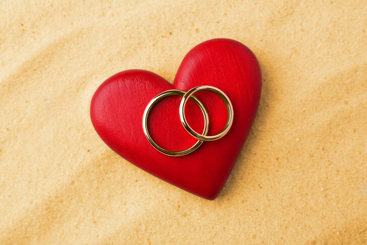 Wedding rings on a red heart