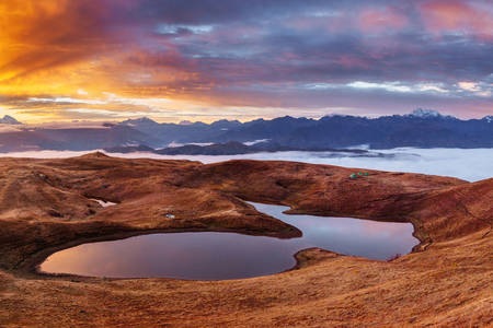 Sunset on the mountain lake Koruldi