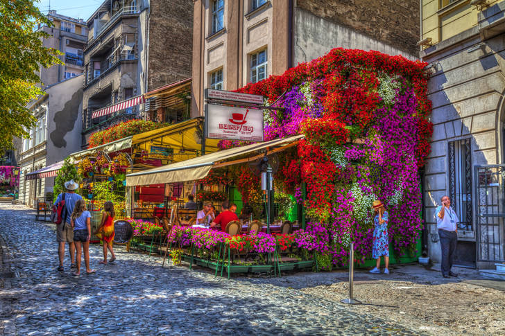 Street cafes entwined with flowers