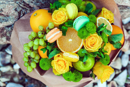 Bouquet of fruits, flowers and macarons