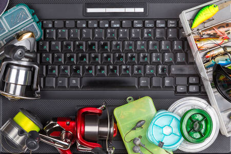 Fishing tackle on a laptop keyboard