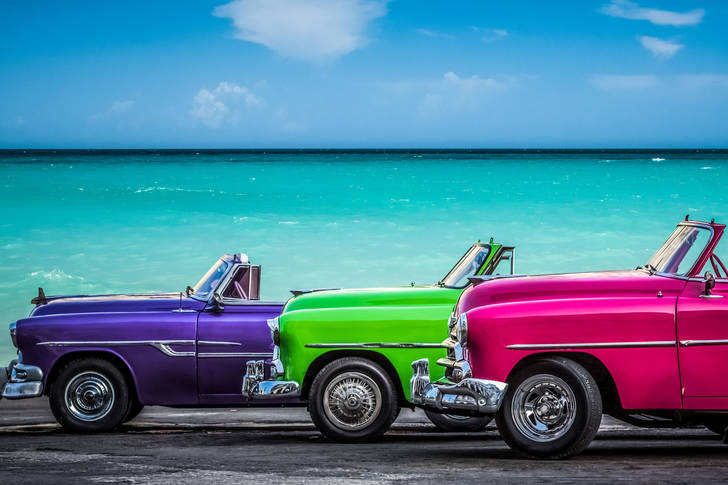 Colorful retro car by the sea