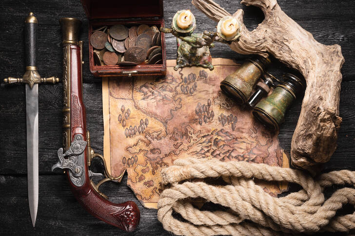 Antique pirate treasure map and musket