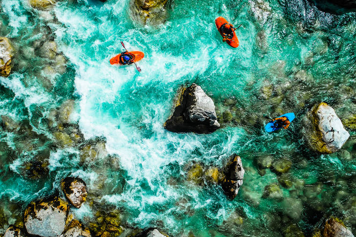 Kayakers on the emerald Soka river
