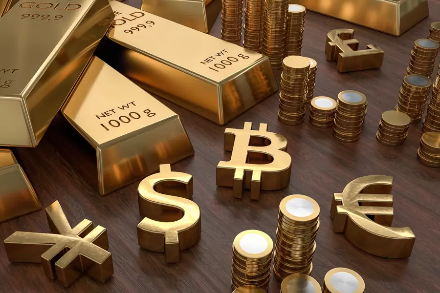 Lingotes de oro y símbolos de moneda