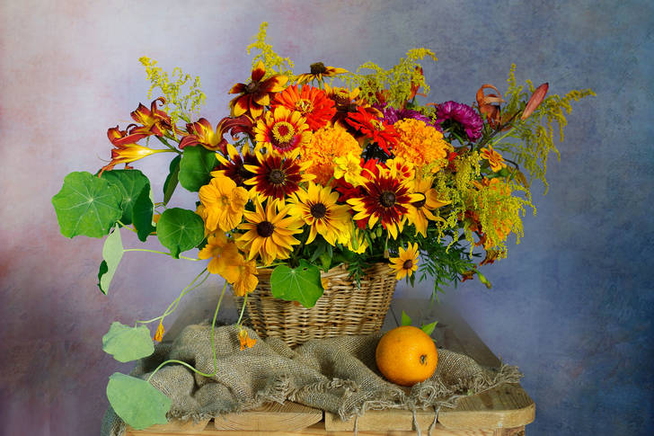 Flowers in a basket on the table