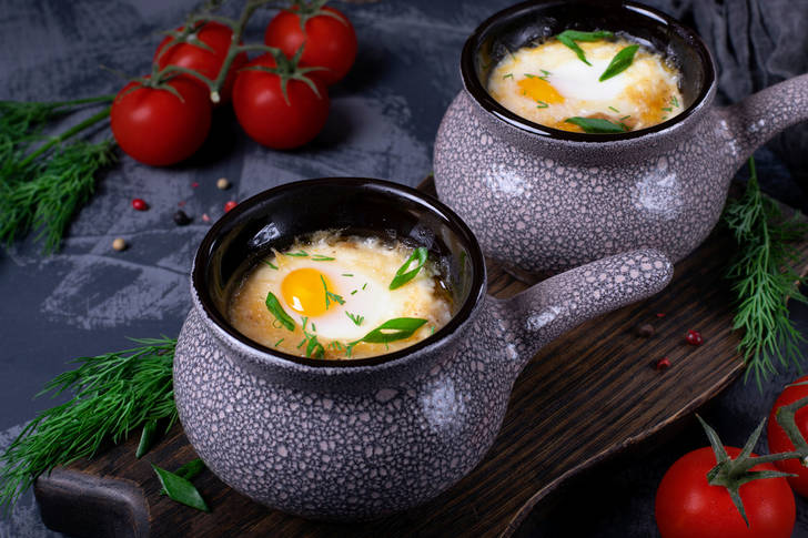 Soup with poached egg in a ceramic bowl